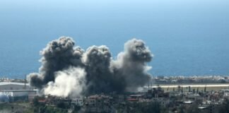 iran-warns-of-‘decisive’-response-to-israeli-strike-on-southern-beirut